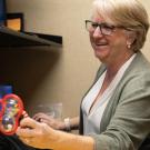Dr. Oakes working with a baby toy in her lab